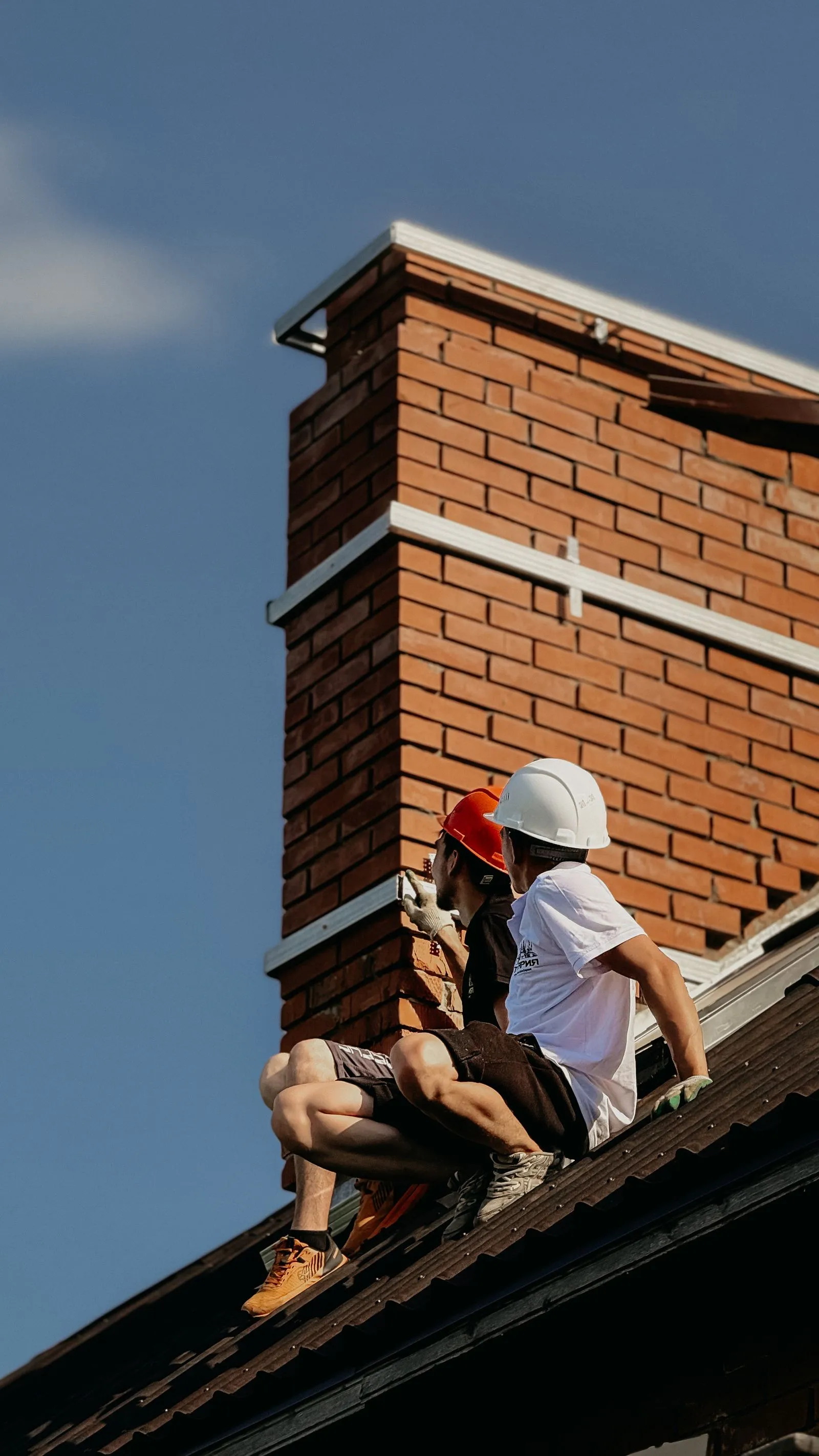 Brick chimney stack on a pitched roof